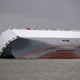 Illustration for article titled These Photos Of That Grounded Car Carrier Ship Are Beautifully Surreal